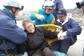Grandmother and boy pulled from rubble NINE DAYS after tsunami smashed city